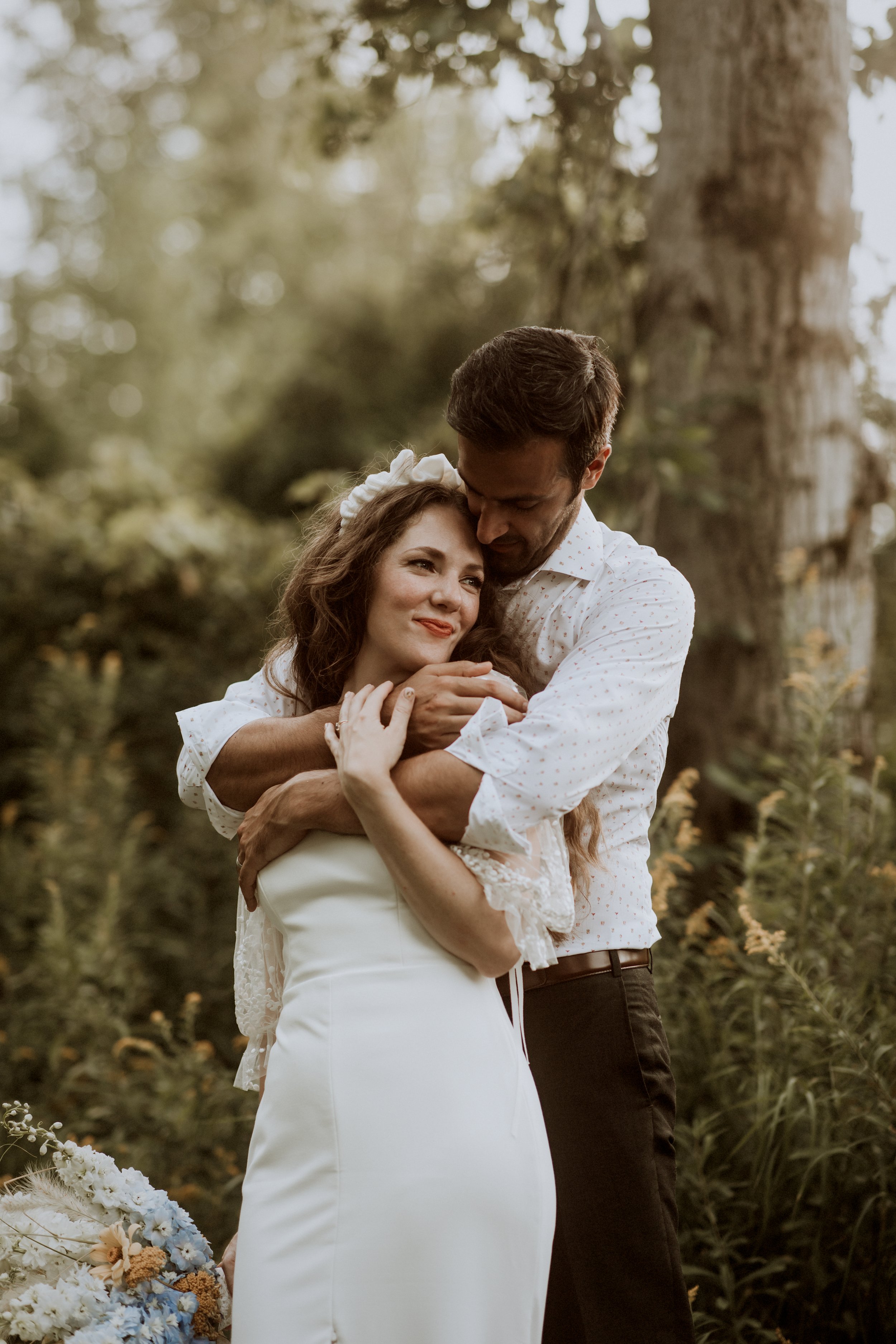 Photo of the happy couple in each other's arms by Rust & Bark.