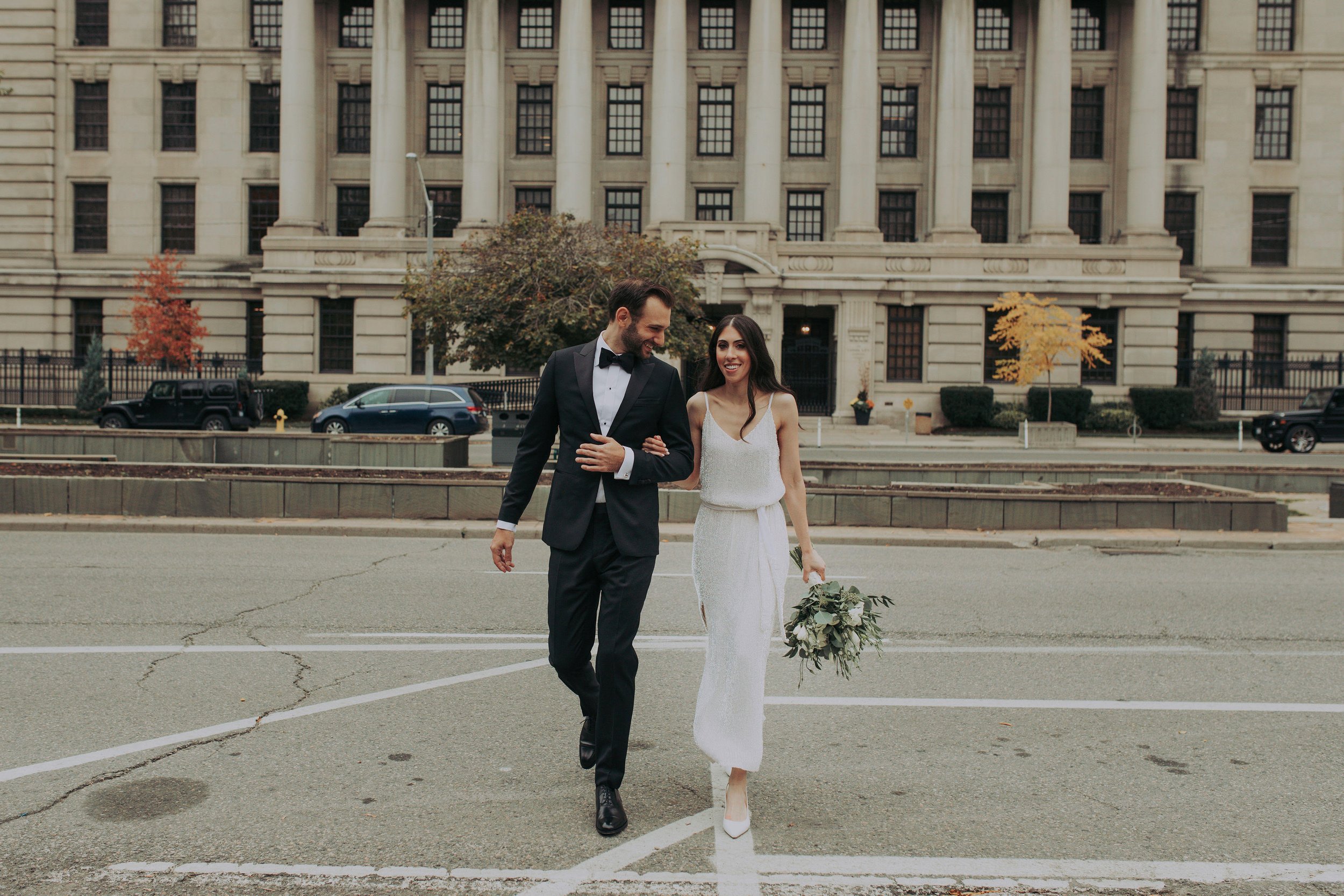 the newlyweds stroll through University Avenue in downtown Toronto