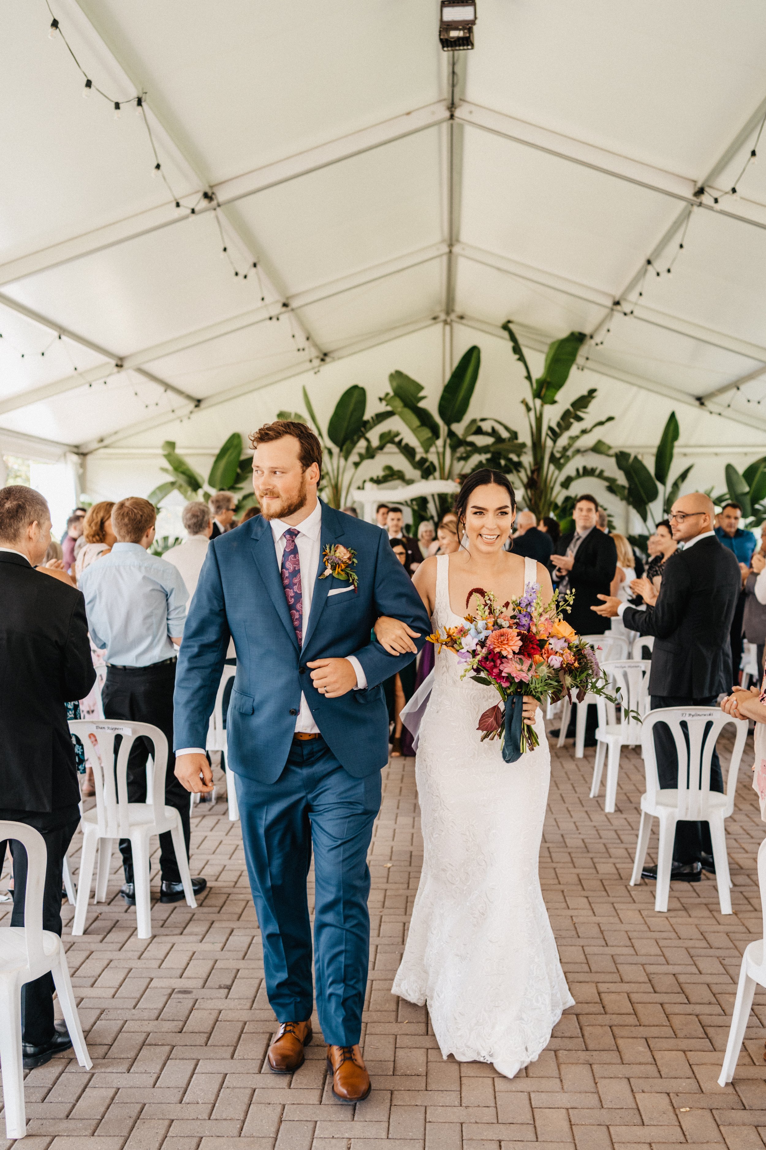 bride and groom walk back down the aisle!