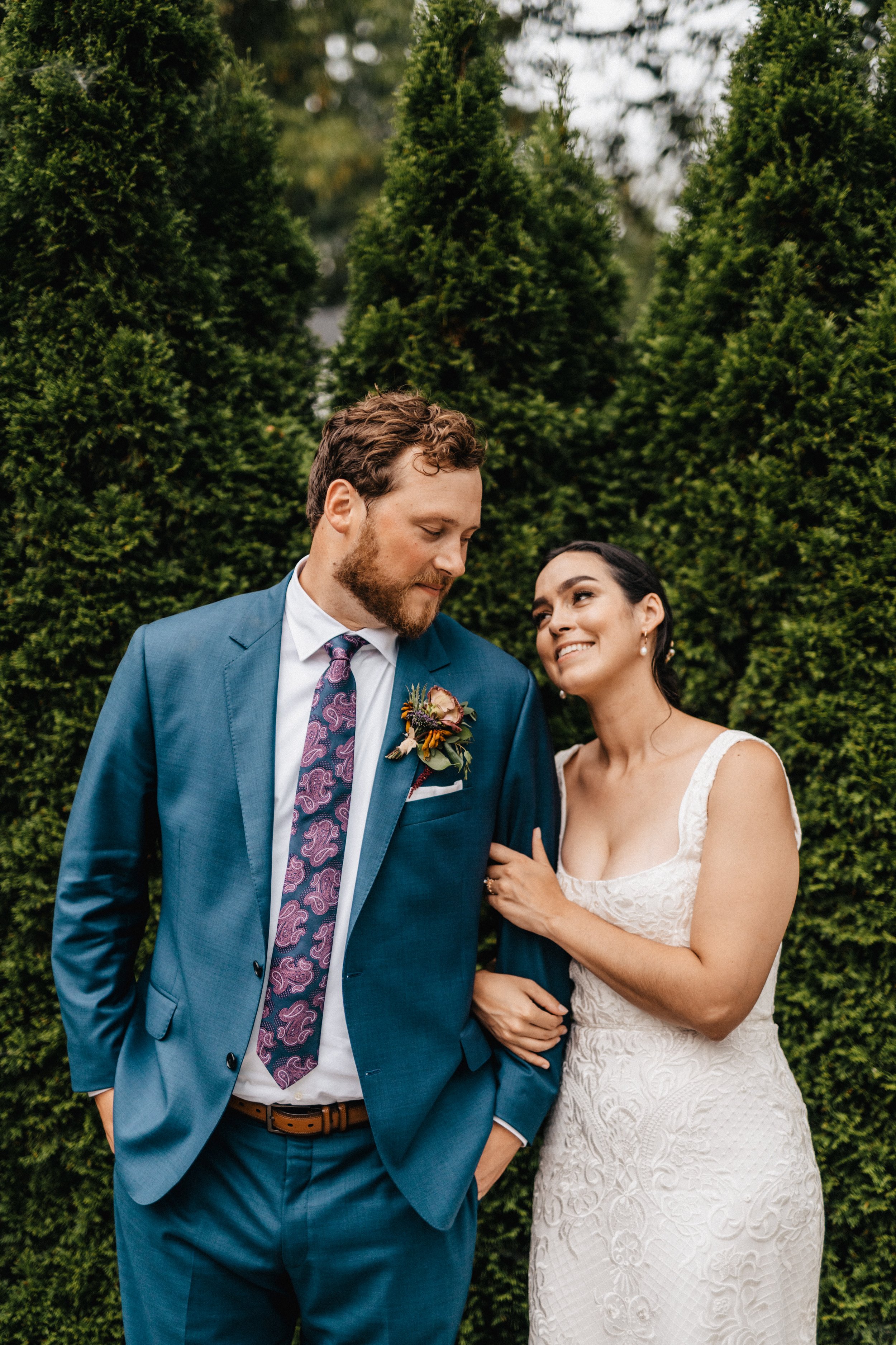 the bride and groom stare into each other's eyes