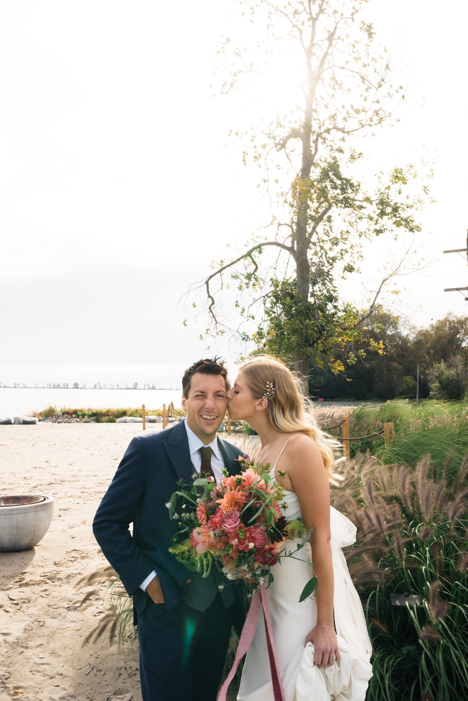 A kiss on the cheek on the beach at Wander the Resort